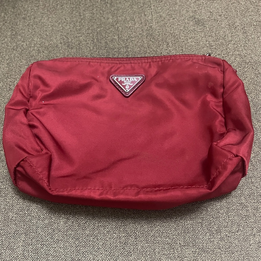 Prada Cosmetic pouch
Burgundy Nylon Zip Pouch with Triangle Logo